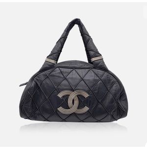 CHANEL Black Quilted Shoulder Bag with Silver Accents